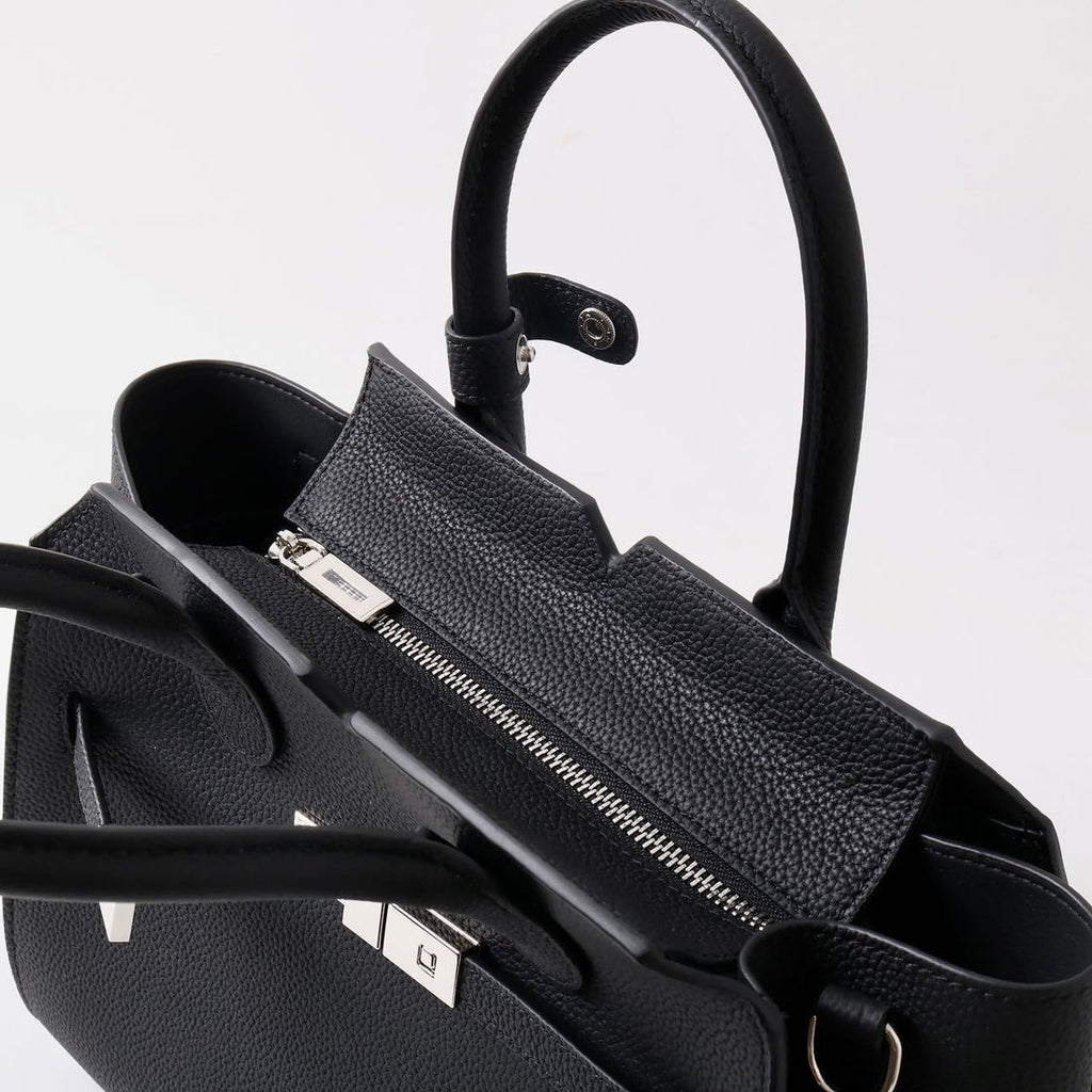 AURORA STRUCTURE” — the leather power bag for everyday icons