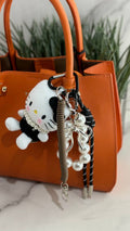 A fluffy Hello Kitty bag charm