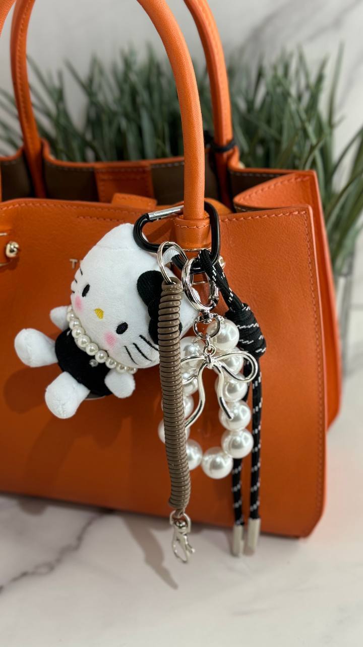 A fluffy Hello Kitty bag charm