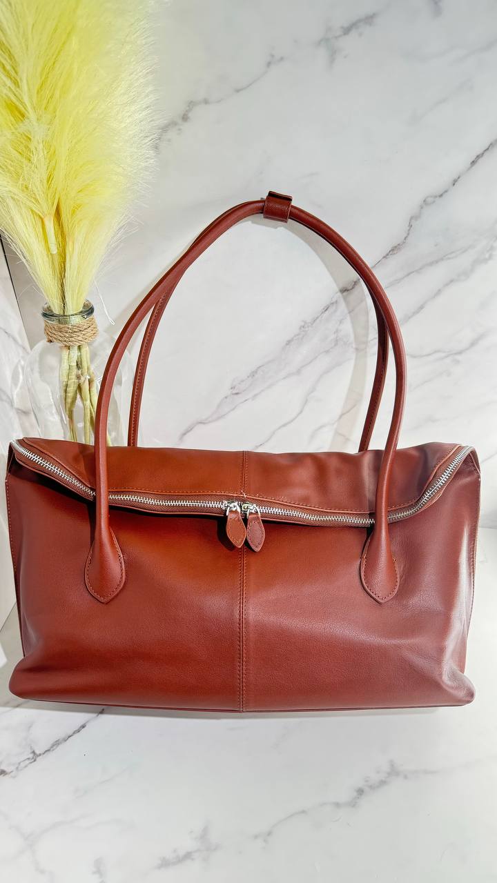 Executive Traveler — a large leather bag for business and travel.