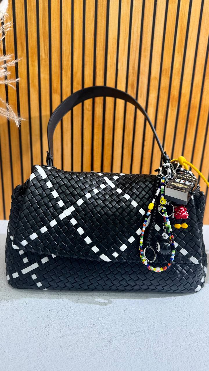 Artisan Weave-The Art of Handwoven Elegance — a handmade leather bag