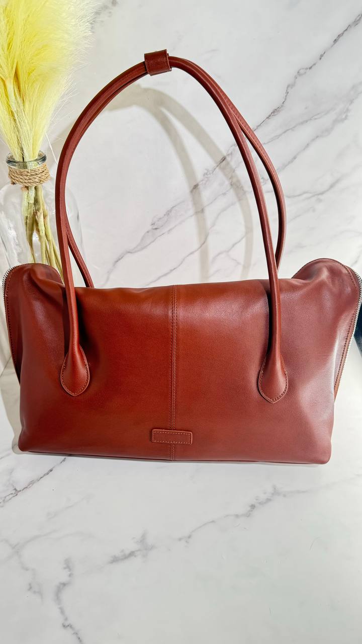 Executive Traveler — a large leather bag for business and travel.