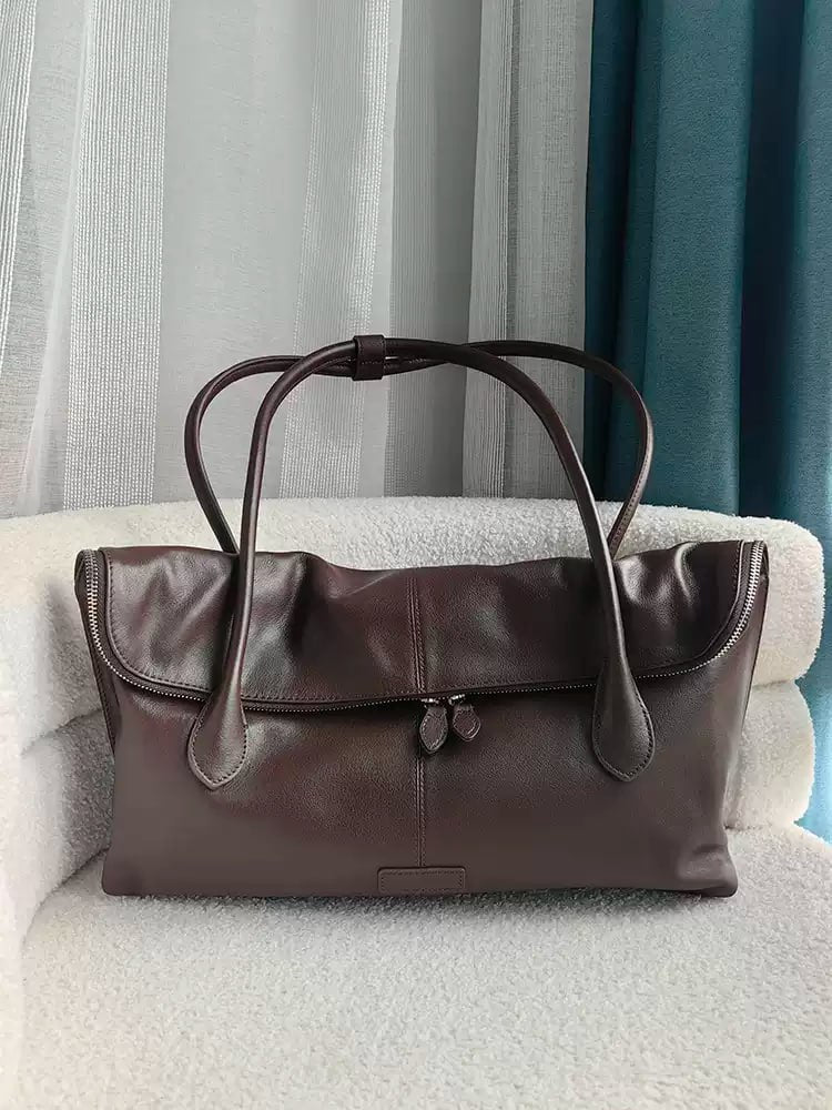 Executive Traveler — a large leather bag for business and travel.