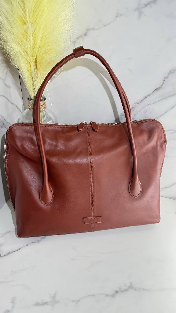 Executive Traveler — a large leather bag for business and travel.