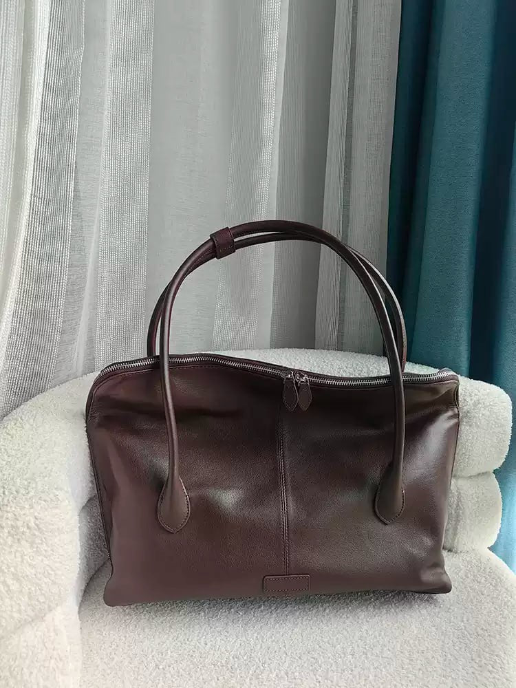 Executive Traveler — a large leather bag for business and travel.