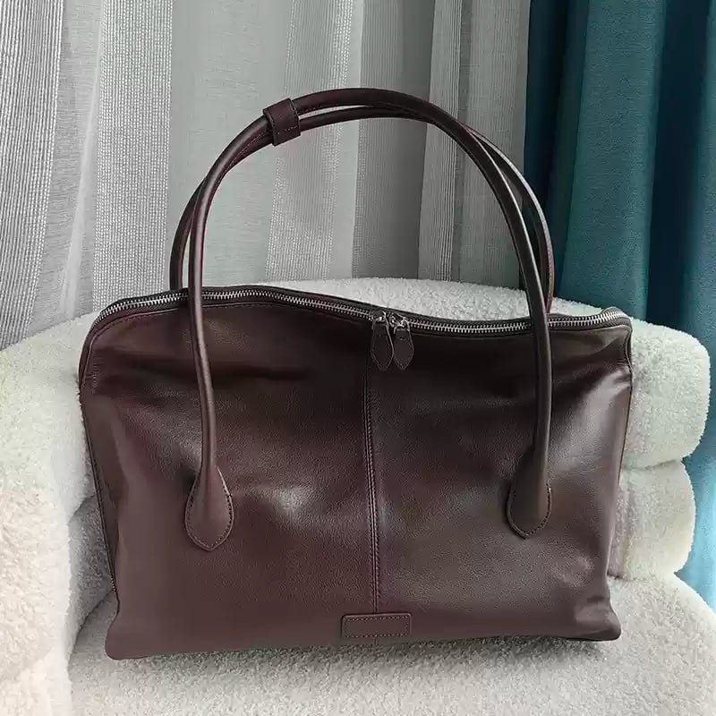 Executive Traveler — a large leather bag for business and travel.