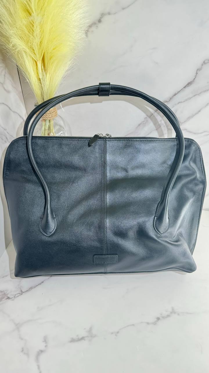 Executive Traveler — a large leather bag for business and travel.